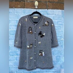 Atelier Sagan textured weave embroidered figures depicting people sweater medium